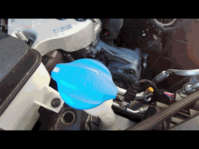 add windshield washer fluid by opening lid of fluid reservoir