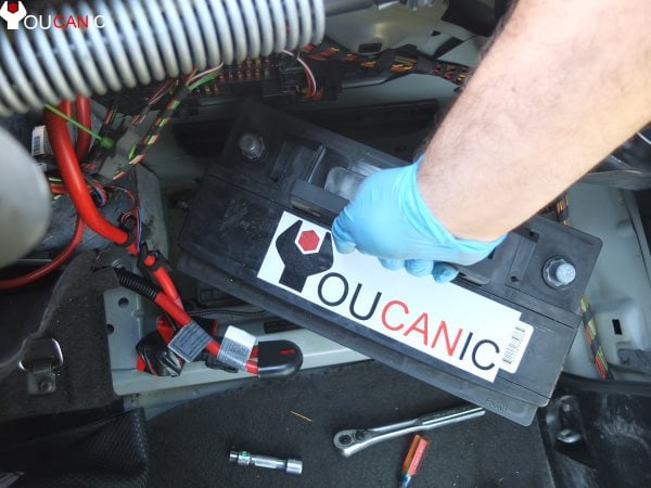 remove bmw battery from tray