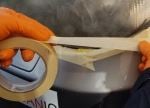 masking tape to protect bmw headlight during diy restore project