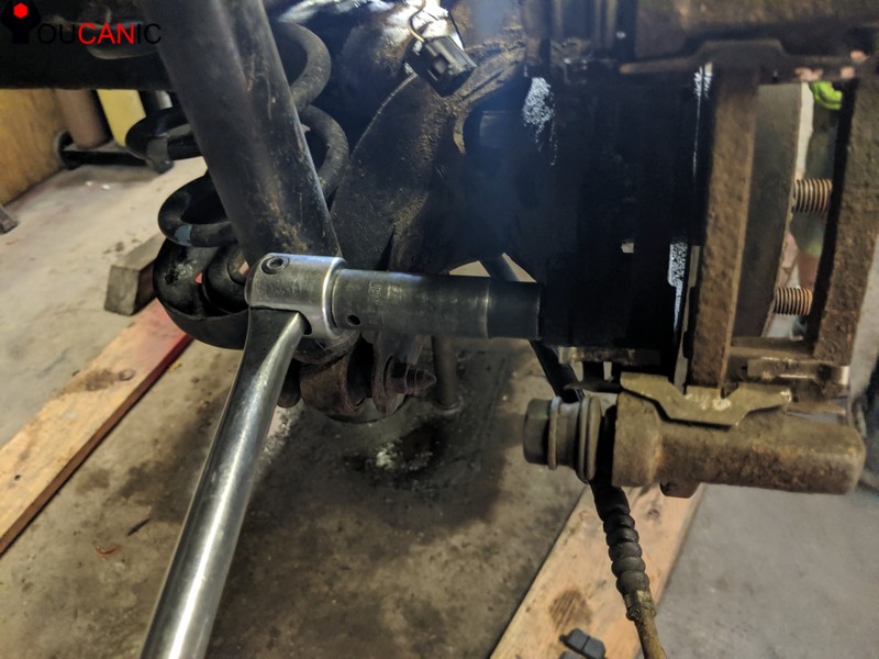 remove toyota rear brake caliper bracket