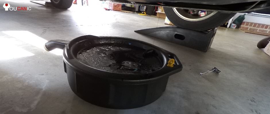 oil drain pan on of the most common tools needed to fix cars yourself