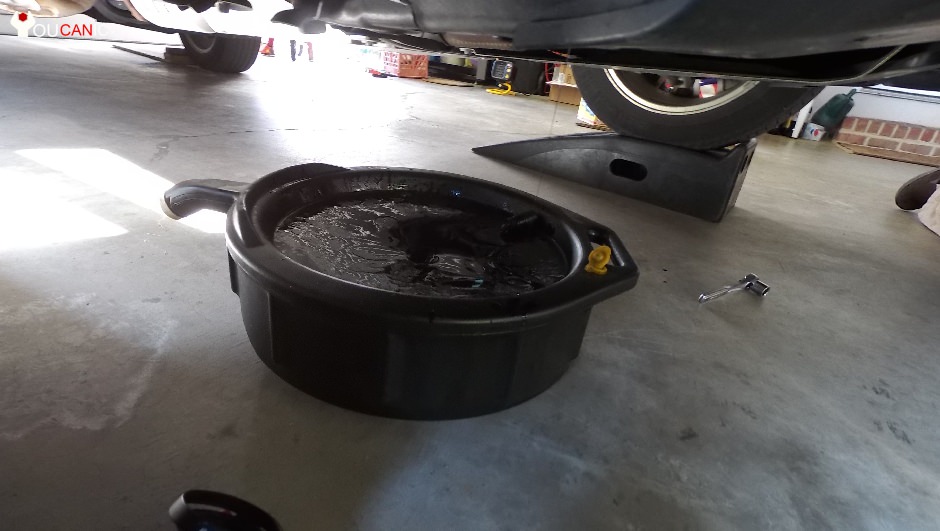 slide oil pan under the engine