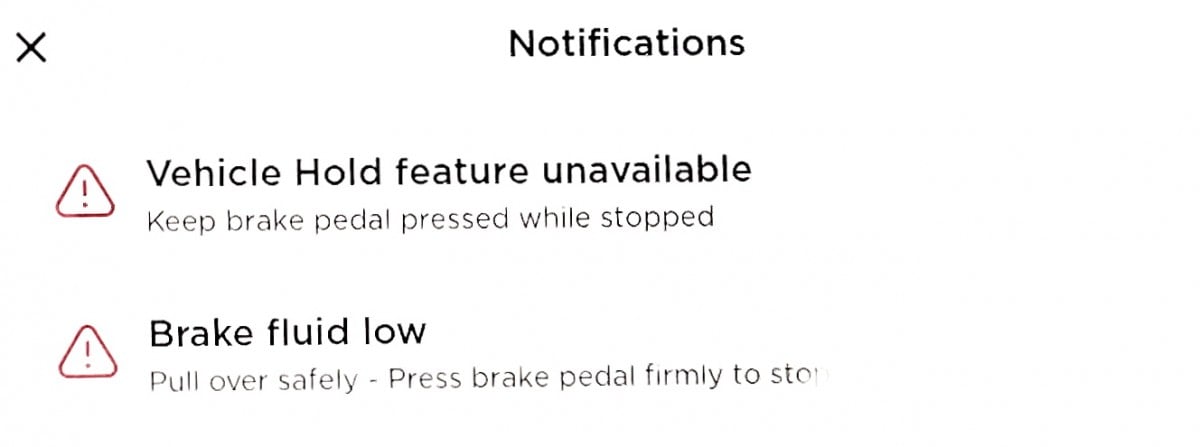 Tesla low brake fluid level warning