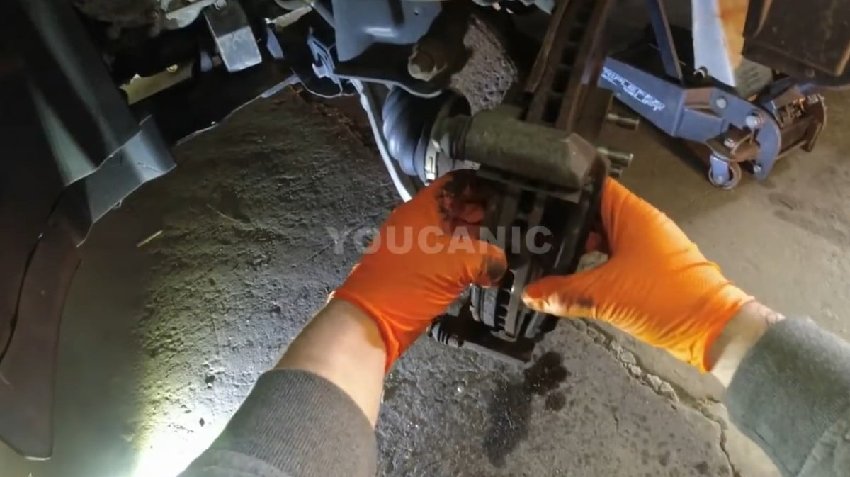 Removing the brake pads of the vehicle.