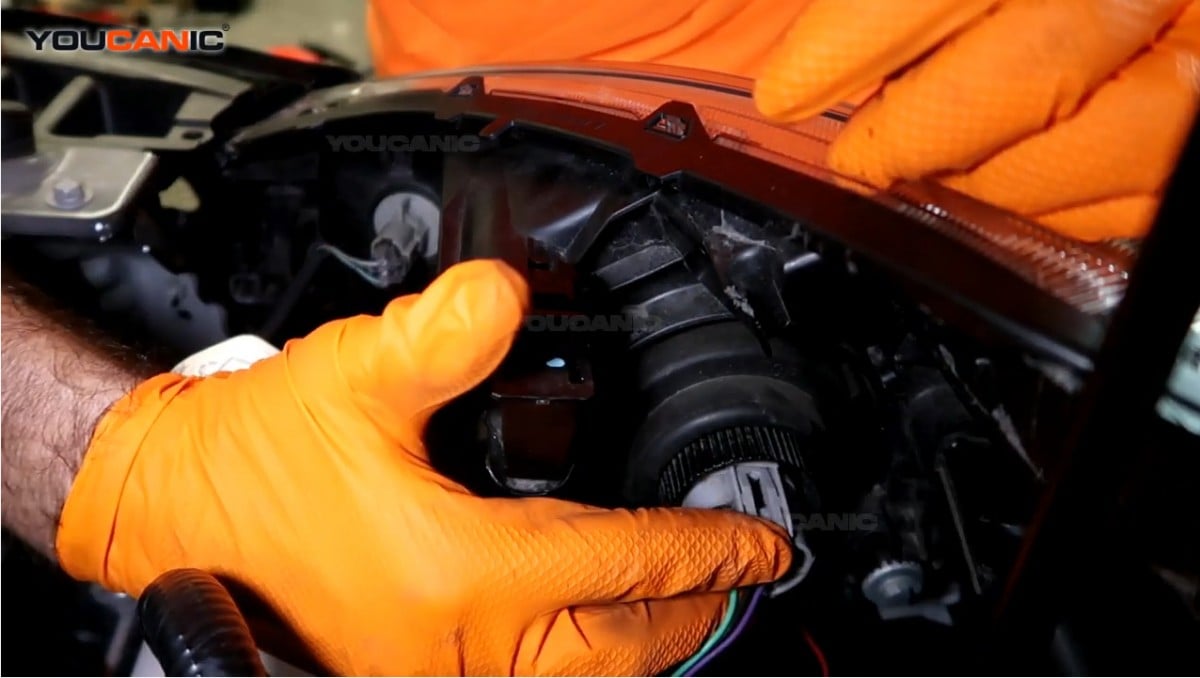 Reconnecting the headlight connector.