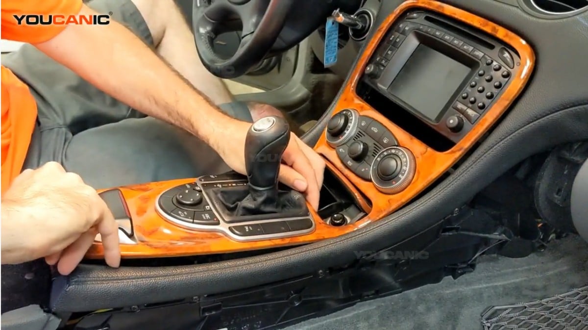 Removing the center control trim of the Mercedes Benz S Class.
