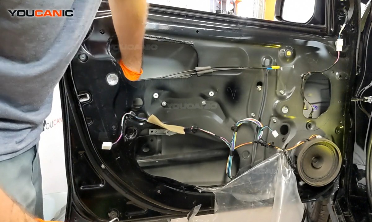 Removing the clip connected to the door actuator.