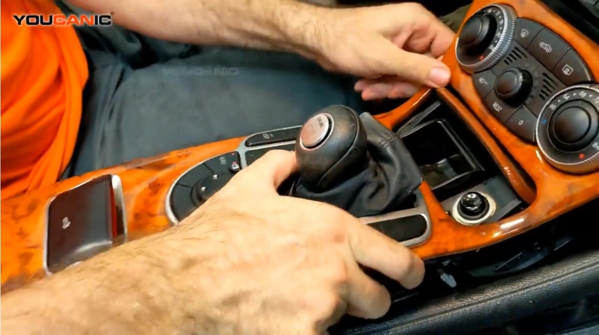 Twisting the gear cover to pull out the center control trim easier.