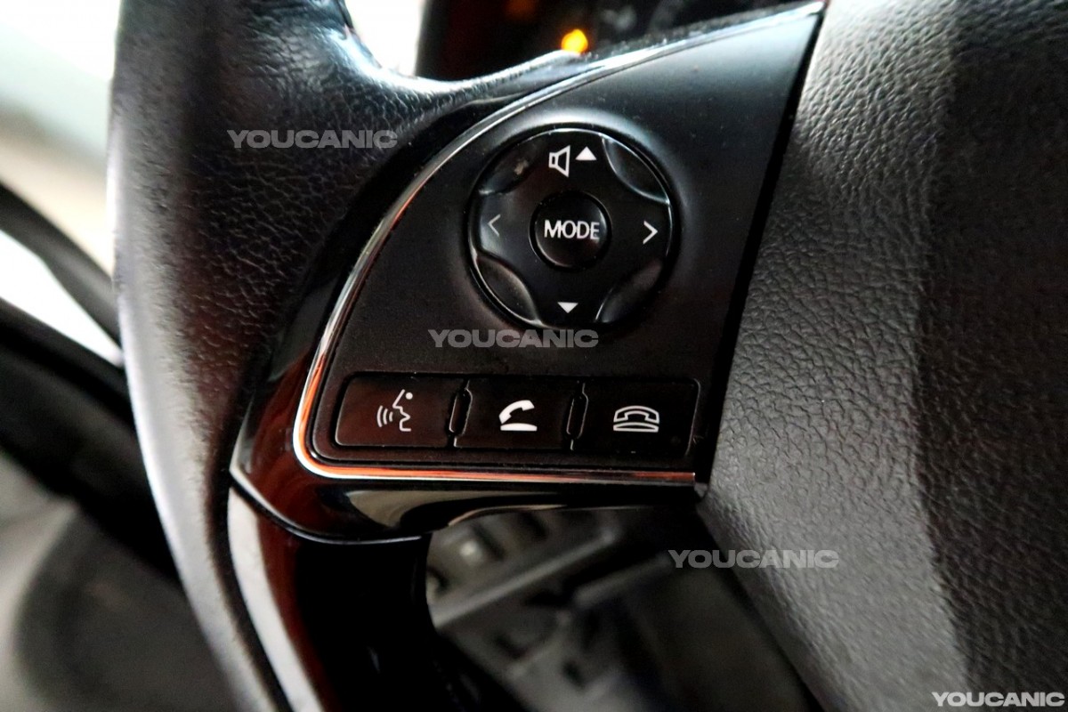 Steering wheel buttons of the Mitsubishi Mirage.