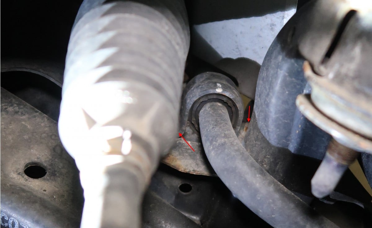 The bolts on the clamp of the sway bar bushing.