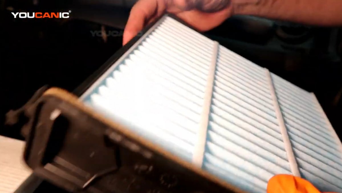 Installing the new cabin air filter.