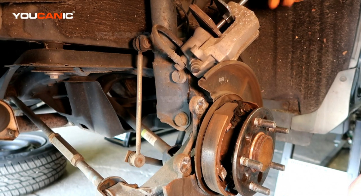 Pushing the piston in using a brake pusher.