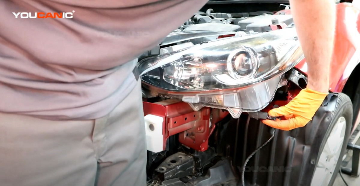 Reconnecting the electrical connector of the headlight assembly.