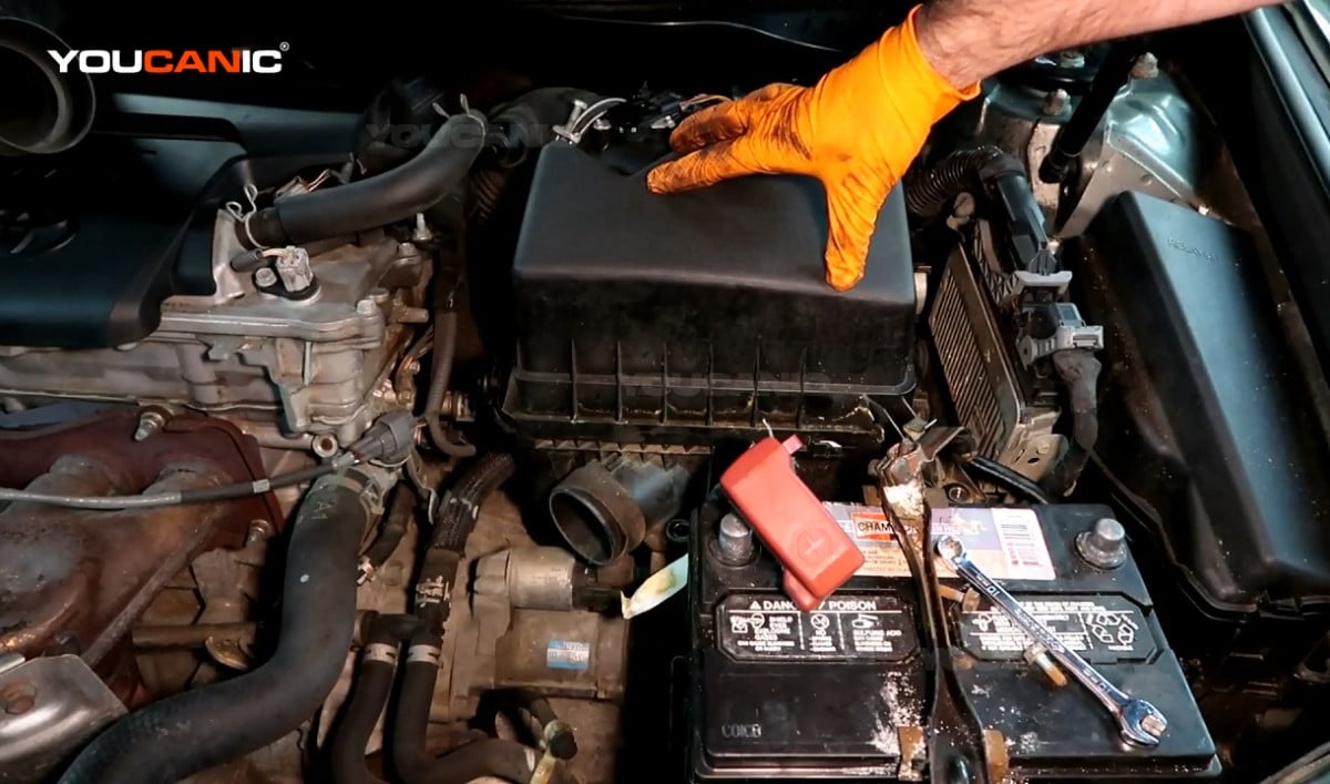 Reinstalling the air filter housing of the Toyota Camry.