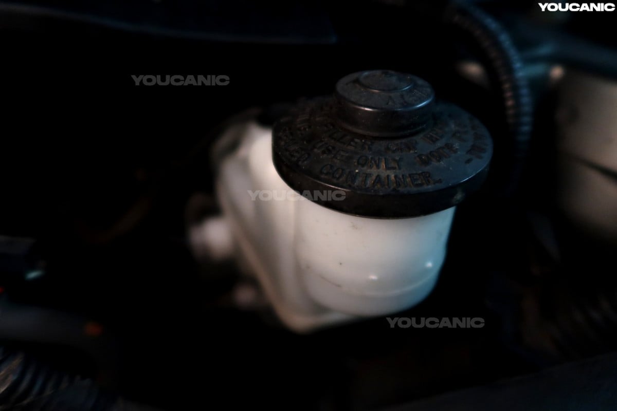 The brake fluid reservoir of the 2012 Toyota Camry.