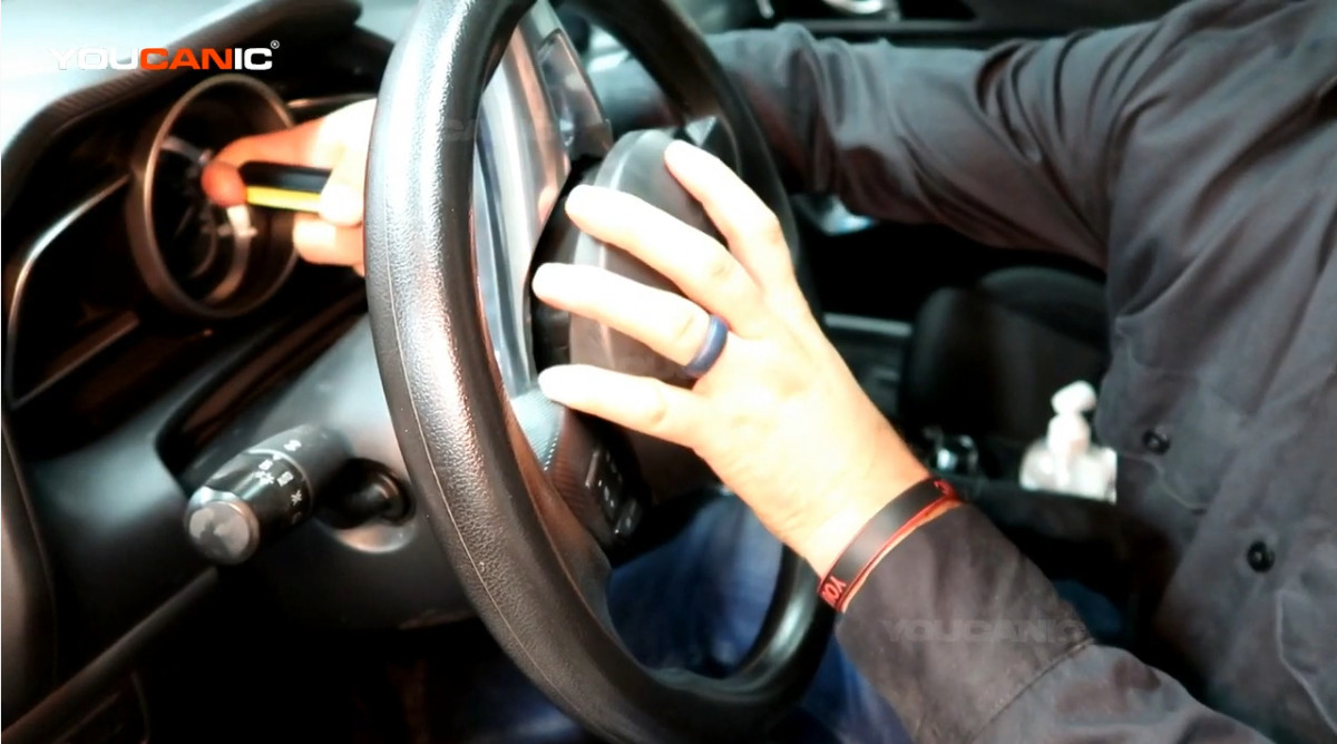 Reinstalling the steering wheel and airbag.