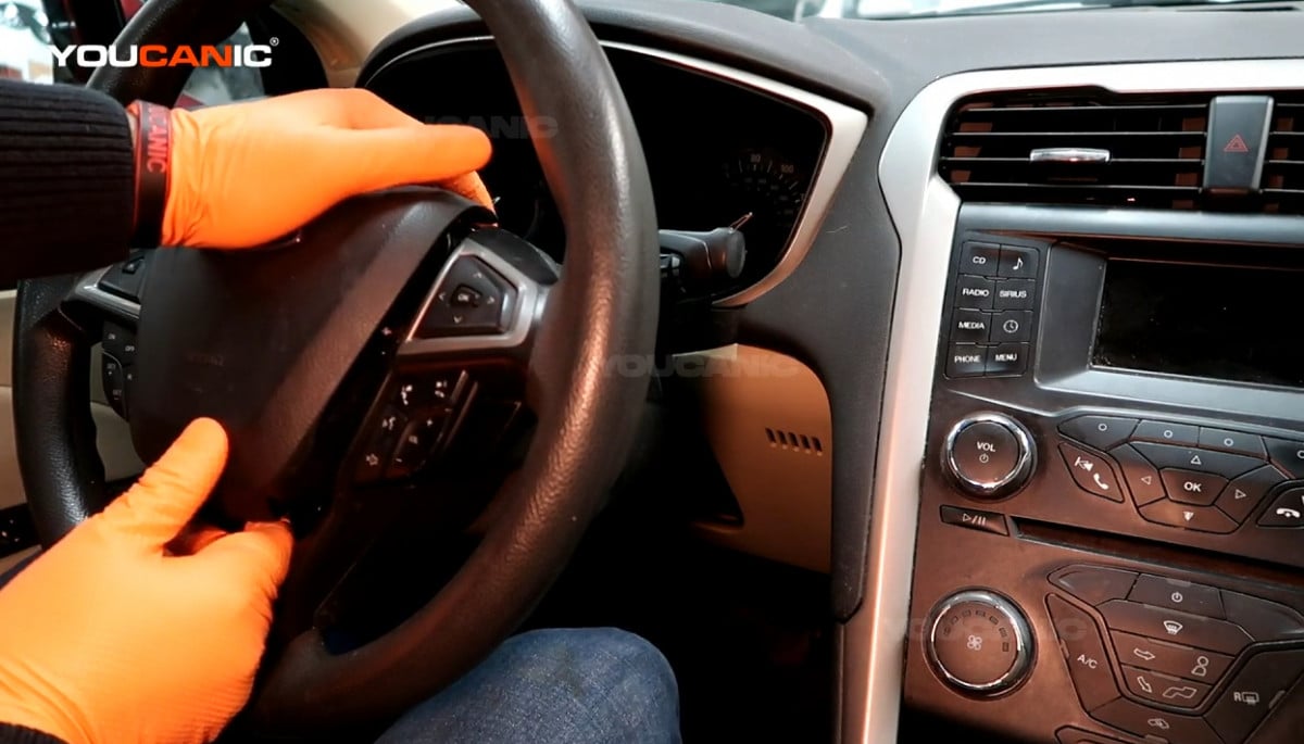 Reinstalling the steering wheel airbag.