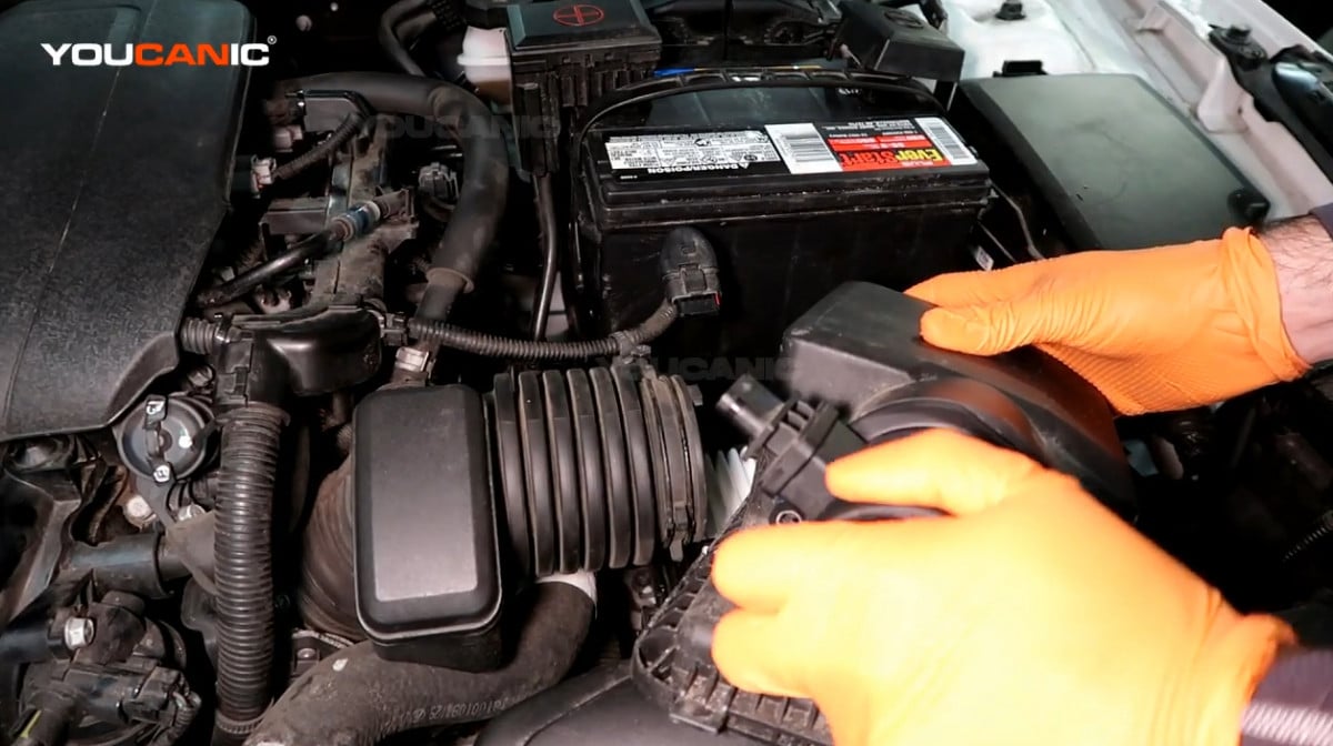 Installing the new or replacement mass air flow sensor of the Kia Forte.