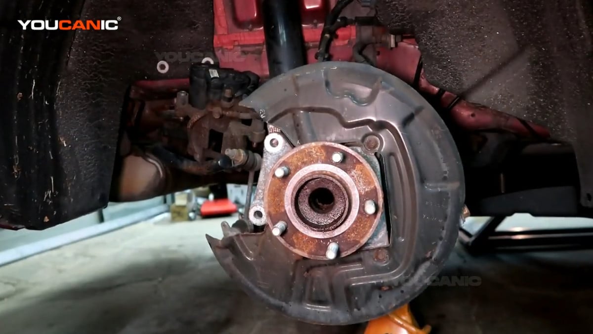 Removing the rotor of the Ford Fusion.