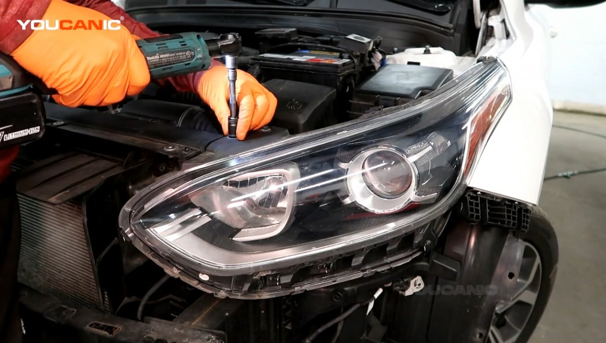 Removing the two 10mm bolt on the front side of the headlight assembly.
