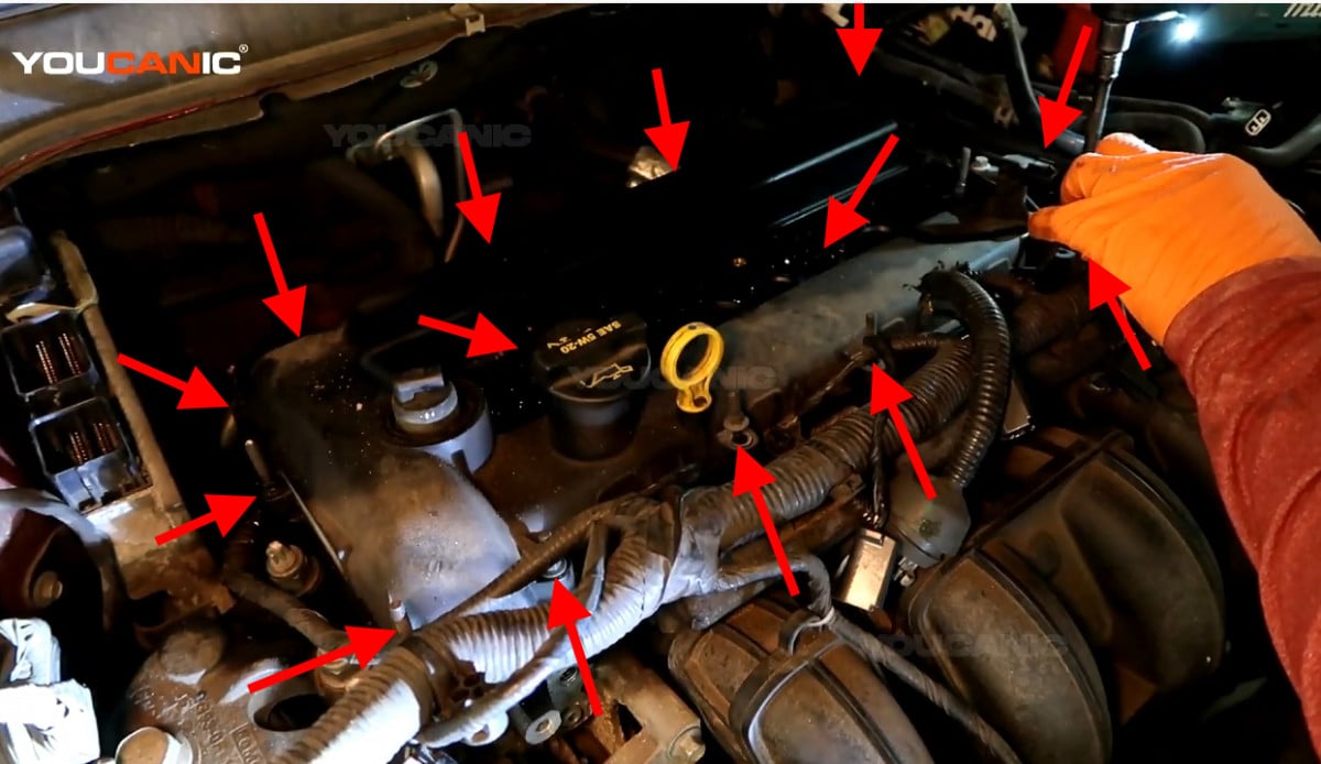 The location of the bolts on the edges of the valve cover.