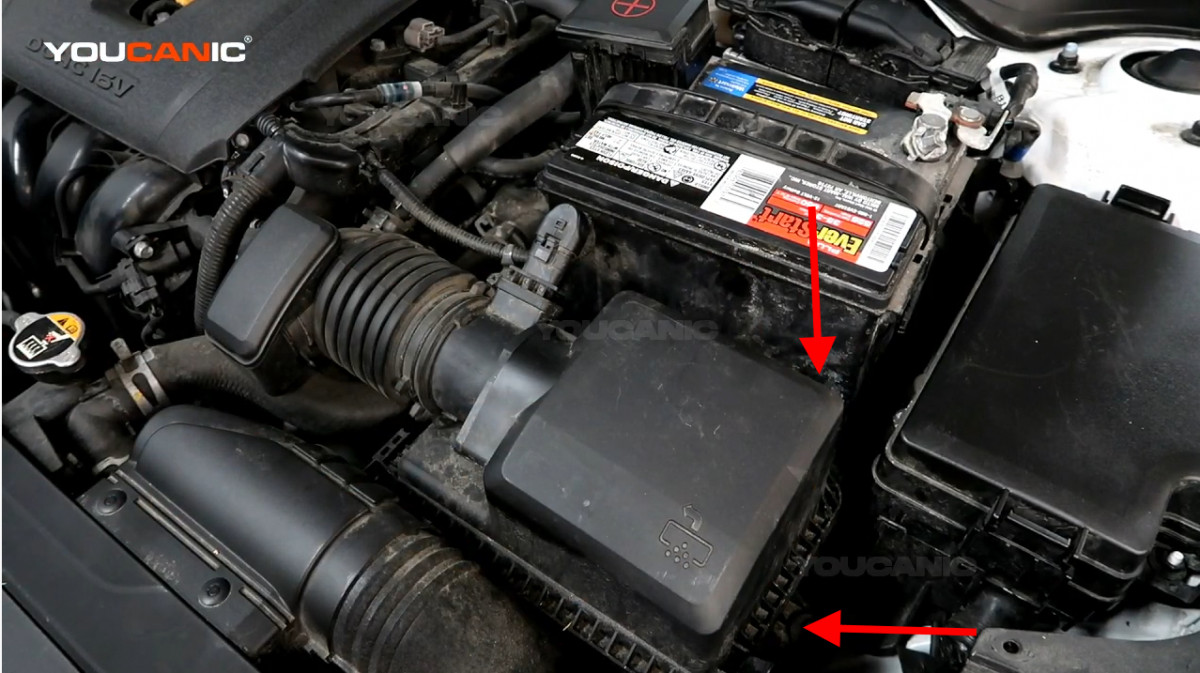 The location of the clips on the air filter housing.