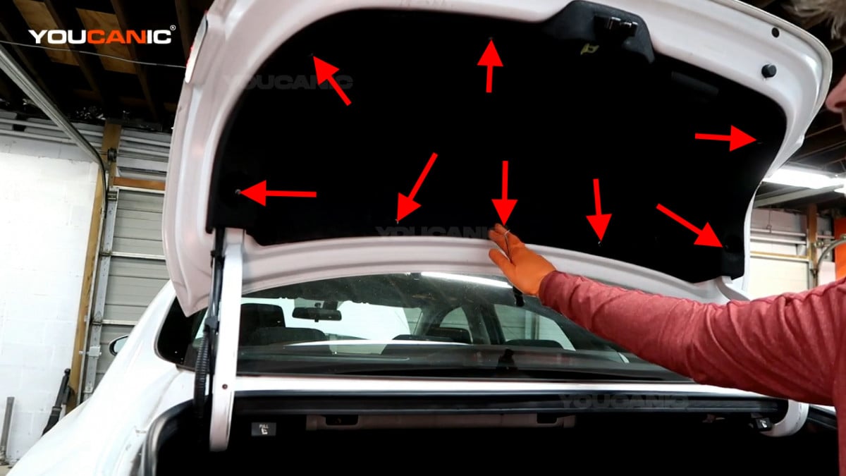 The location of the eight push clips on the door trunk shield.