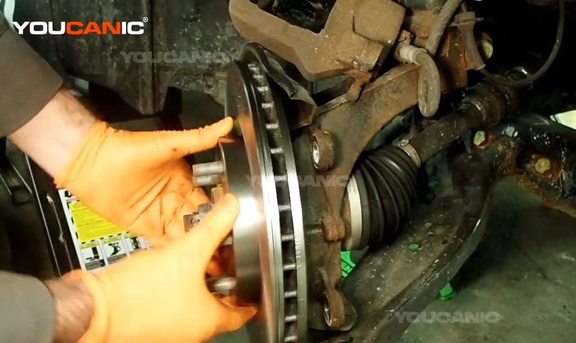 Installing the new rotor of the Nissan Rogue Sport.