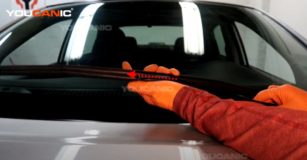 Installing the new wiper arm of the Nissan Sentra.