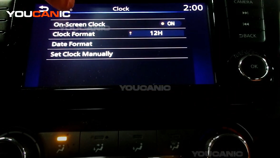 The Clock Menu on the Vehicle's Car Stereo.